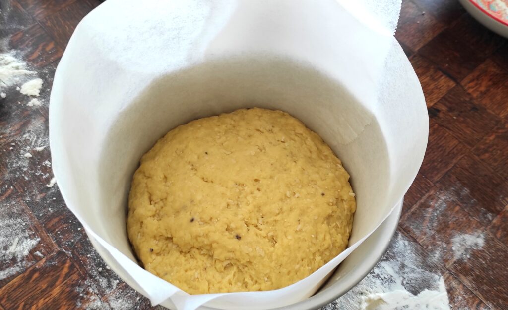 Parchment paper wrapped inside the tin to make the sides taller